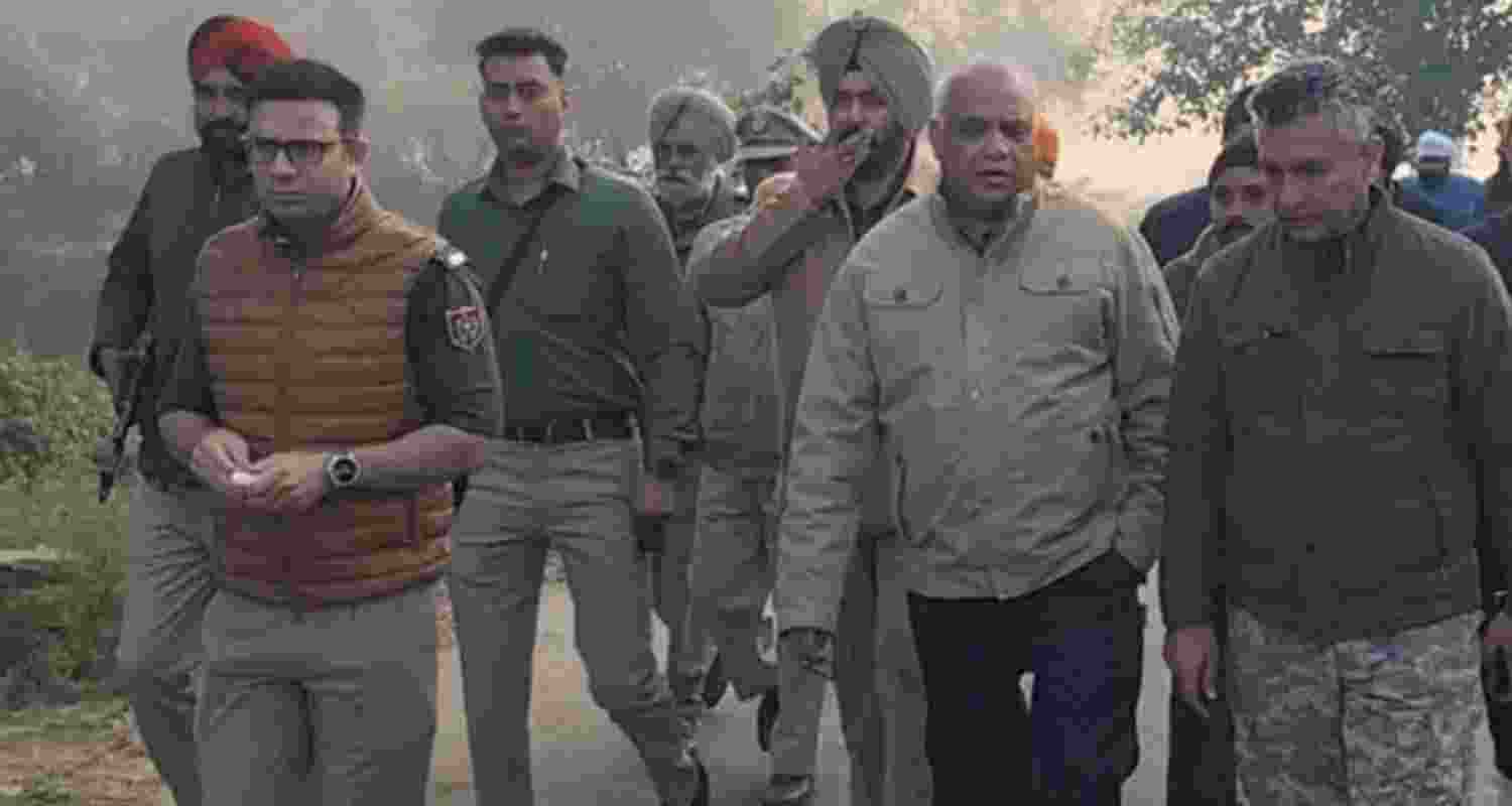 DIG (Border Range) Sandeep Goel (second from right) and Amritsar Rural SSP Suhail Qasim Mir (extreme left) at the spot of the encounter, along with other policemen, in Amritsar on Monday.