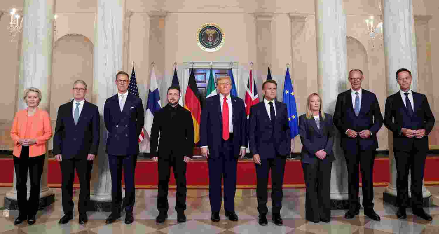 US President Donald Trump, Ukrainian President Volodymyr Zelenskiy, German Chancellor Friedrich Merz, French President Emmanuel Macron, British Prime Minister Keir Starmer, Italian Prime Minister Giorgia Meloni, and Finland's President Alexander Stubb, NATO Secretary General Mark Rutte and European Commission President Ursula von der Leyen pose for a family photo amid negotiations to end the Russian war in Ukraine, at the White House in Washington, D.C., U.S.