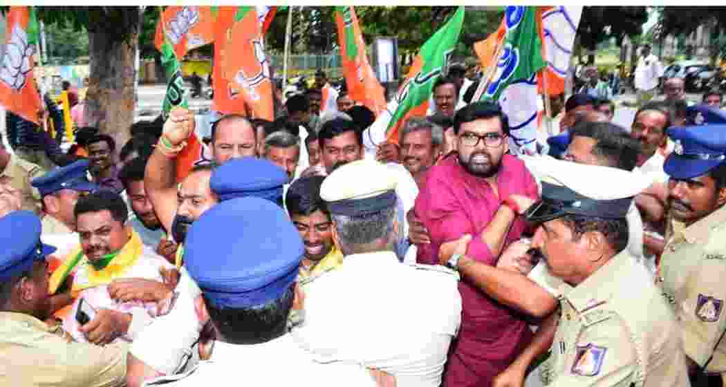 The police stopping BJP workers from laying siege to the Congress office in Mandya, Karnataka, on Thursday.