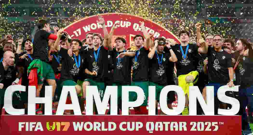 Portugal's players celebrate with the trophy on the podium after the FIFA U17 World Cup final football match against Austria.