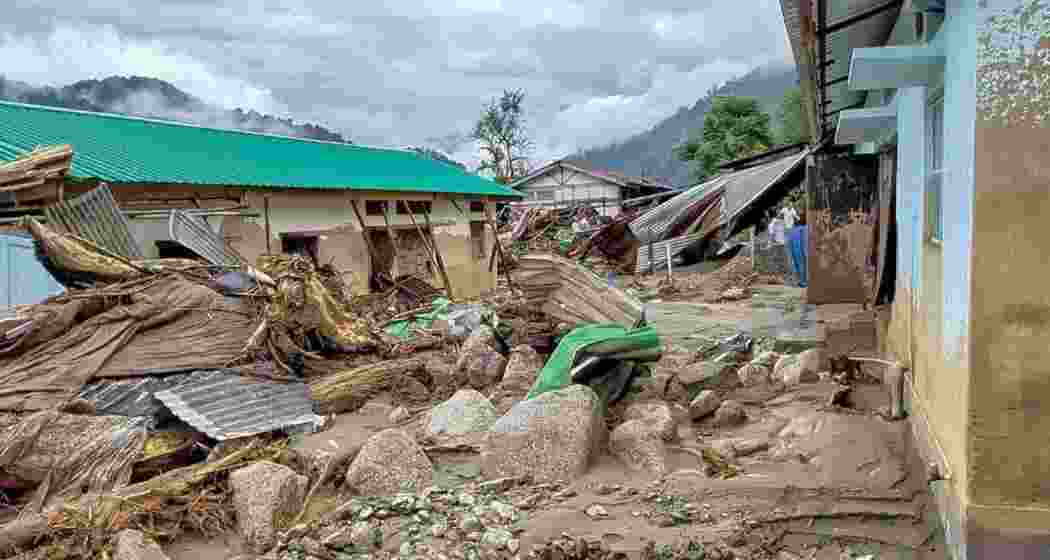 Widespread devastation caused by flash floods and heavy rainfall at NEEPCO colony, in Keyi Panyor on Wednesday.