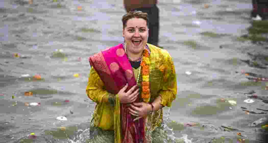 A foreign devotee experiences spiritual bliss during Amrit Snan at the Triveni Sangam on Basant Panchami in Prayagraj.