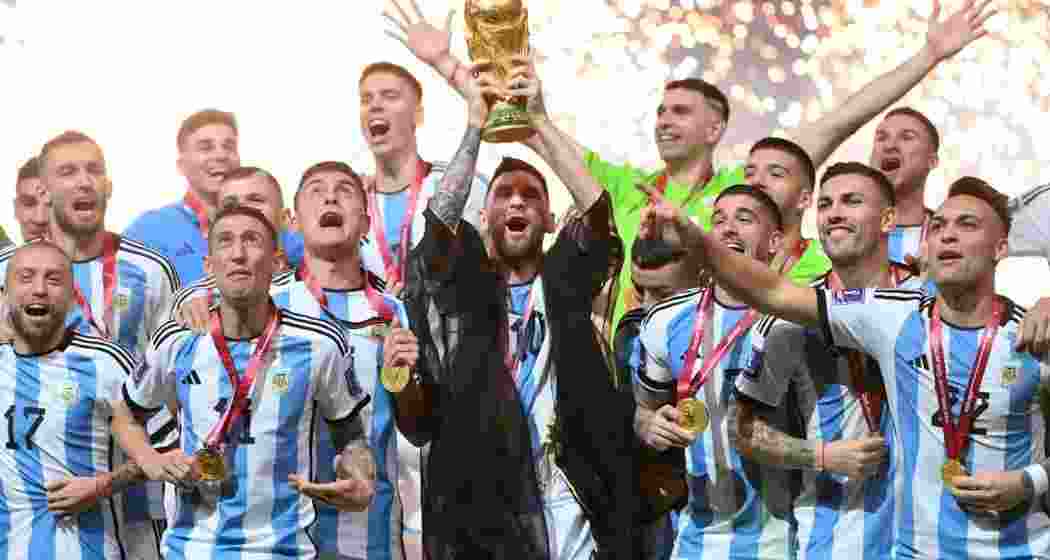 A file photograph of Argentina celebrating with the FIFA World Cup trophy in 2022. Whether they can defend their title remains to be seen.