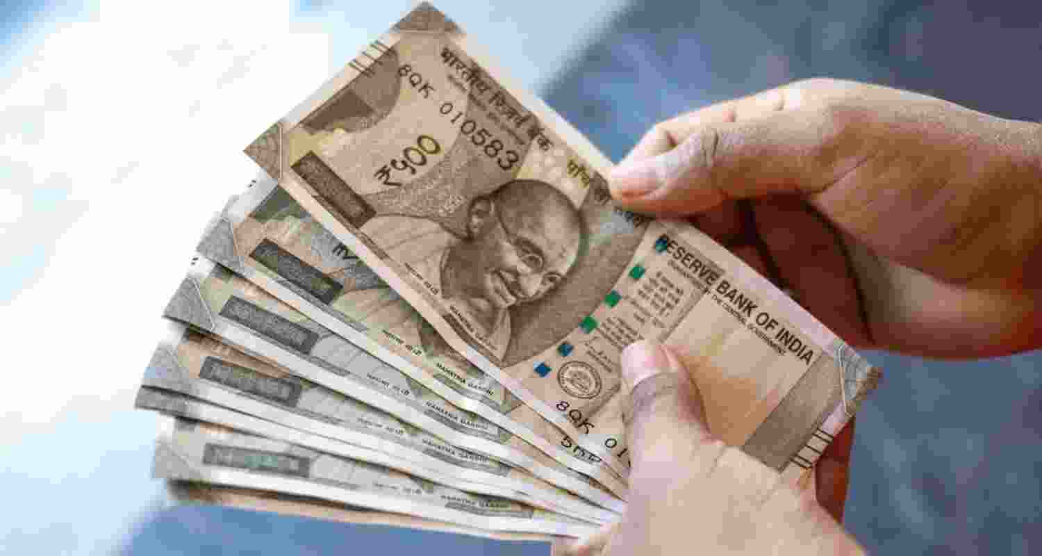 The rupee settled at 88.12 against US dollar on Tuesday after remaining under pressure over worries surrounding US-India trade tensions and persistent foreign portfolio outflows