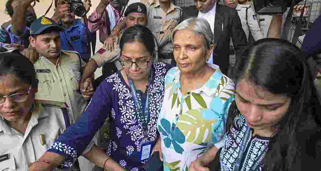 Prime accused Giribala Singh comes out of a local court after being remanded to five-days CBI custody in connection with the death case of her daughter-in-law Twisha Sharma, in Bhopal, Madhya Pradesh, on Friday.