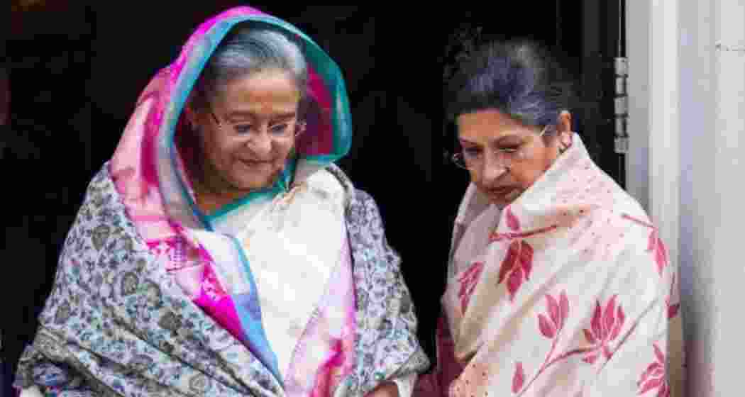 Former Prime Minister of Bangladesh, Sheikh Hasina (L), with sister, Sheikh Rehana (R).