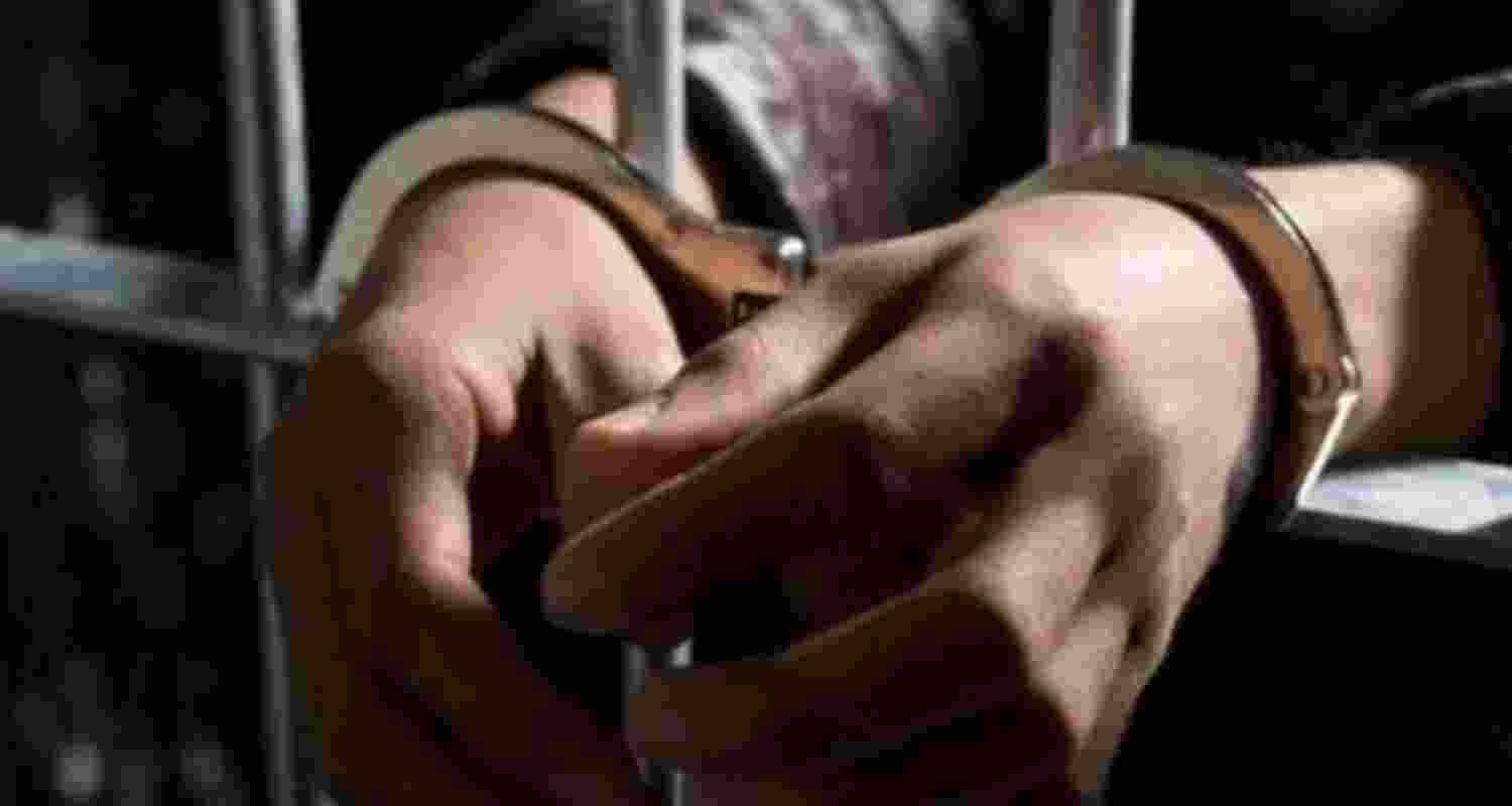 Image of arrested man. 