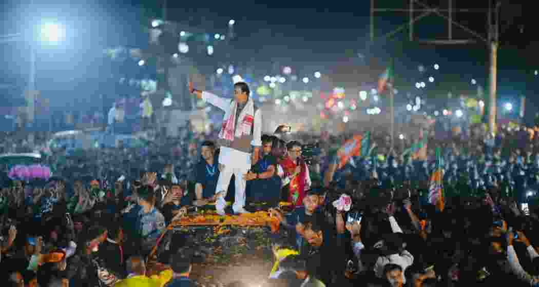 Assam Chief Minister Himanta Biswa Sarma waves to supporters during an election campaign rally in Lakhimpur ahead of the Assembly polls.