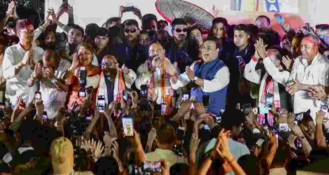 Assam Chief Minister and BJP candidate from Jalukbari constituency, Himanta Biswa Sarma, celebrates with party workers after winning in the state Assembly election results, in Guwahati, on May 4.
