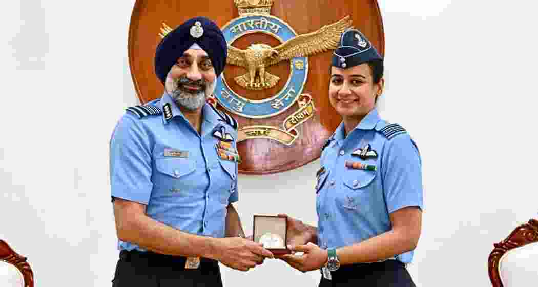 Indian Air Force Chief Air Chief Marshal A P Singh felicitates Saanya after she became the first woman officer in the Indian Air Force to earn the prestigious Cat-A Qualified Flying Instructor (QFI) qualification, during a ceremony recognising excellence in military aviation training and instructional capability.