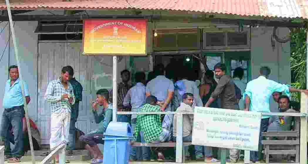 People stand in a queue outside the Mizoram ILP cell in Aizawl to obtain Inner Line Permits.