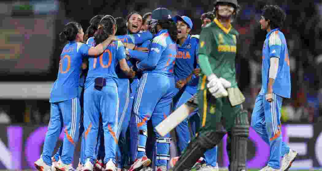 Indian players celebrate the wicket of South Africa's Chloe Tryon during the ICC Women's World Cup final ODI cricket match between India Women and South Africa Women, at the DY Patil Stadium, in Navi Mumbai on Sunday.