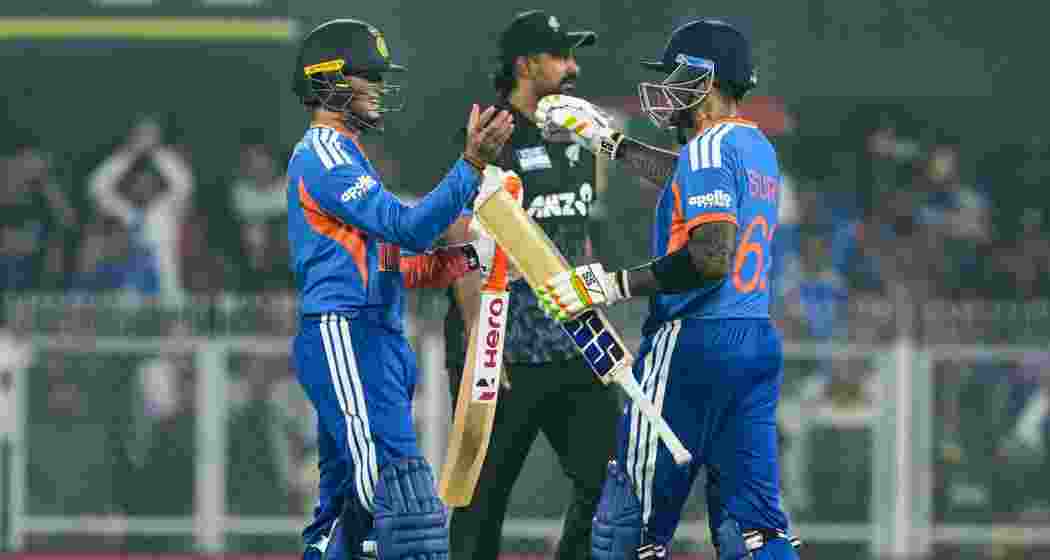 India's Abhishek Sharma being greeted by captain Suryakumar Yadav after his half century during the third T20I cricket match between India and New Zealand, at ACA Stadium, Barsapara in Guwahati on Sunday.