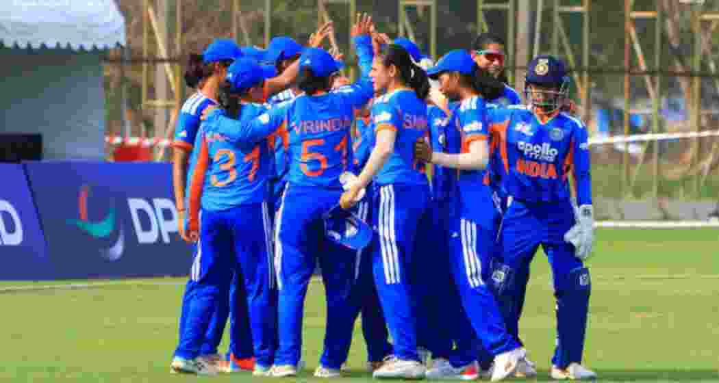 Strategy session before Indian players take the field.