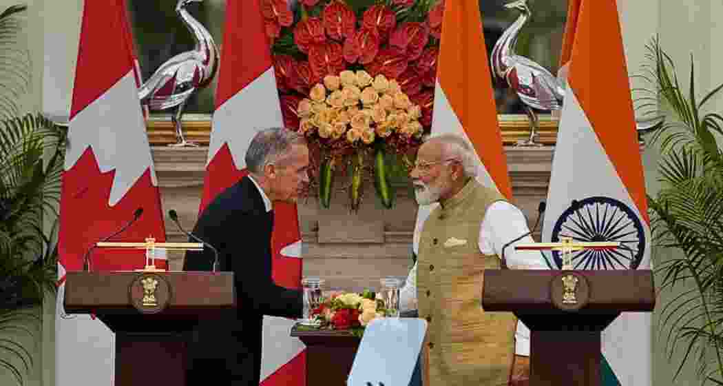 India Prime Minister Narendra Modi, right, shakes hand with his Canadian counterpart Mark Carney after signing of various memorandum of understanding between the two nations in New Delhi, India on Monday.