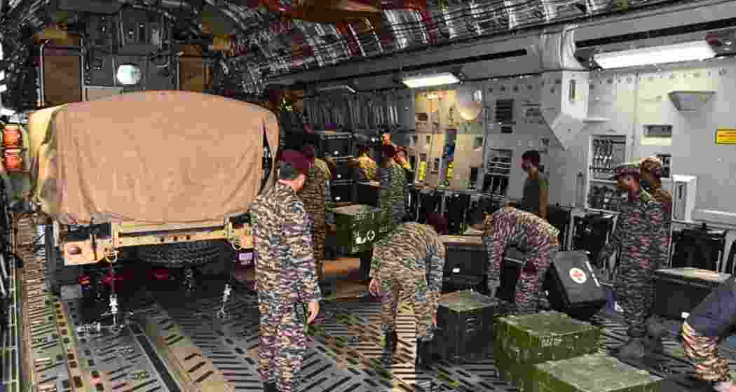 Army personnel load humanitarian aid and the BHISHM field hospital aboard an Indian Air Force C-17 aircraft before its departure for earthquake-hit Venezuela under Operation Amistad.