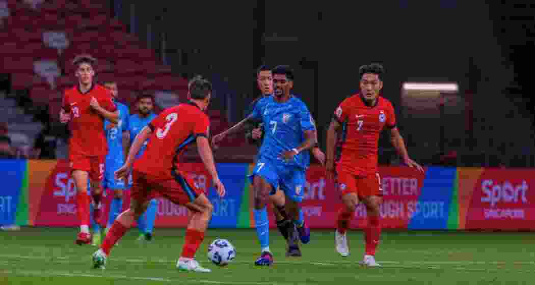 Indian and Singapore players in action during the AFC Asian Cup Qualifier match in Singapore, where India held the hosts to a 1-1 draw.