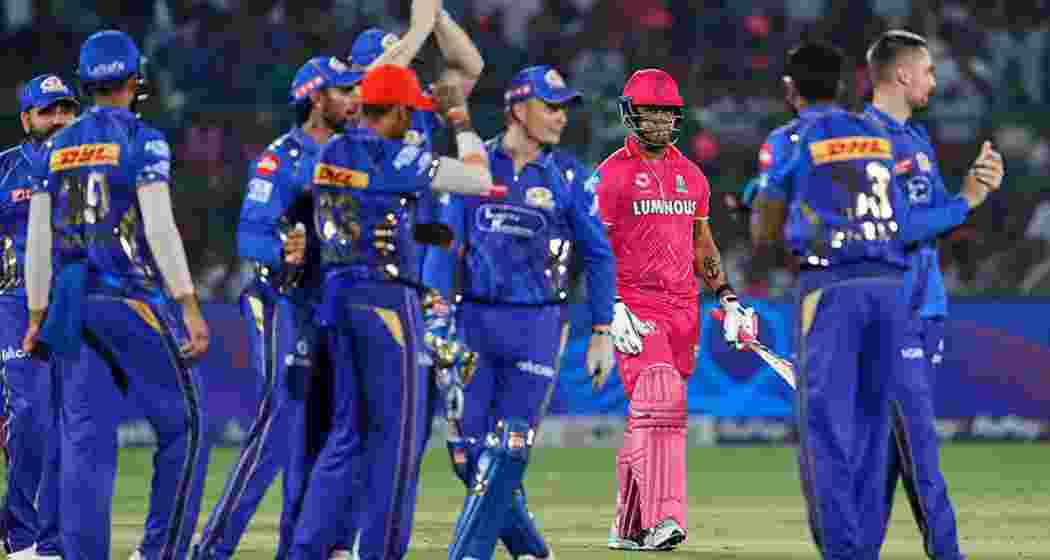 Mumbai Indians players celebrate a wicket during their emphatic 100-run victory over Rajasthan Royals at the Sawai Mansingh Stadium in Jaipur on Thursday, May 1, in IPL 2024.