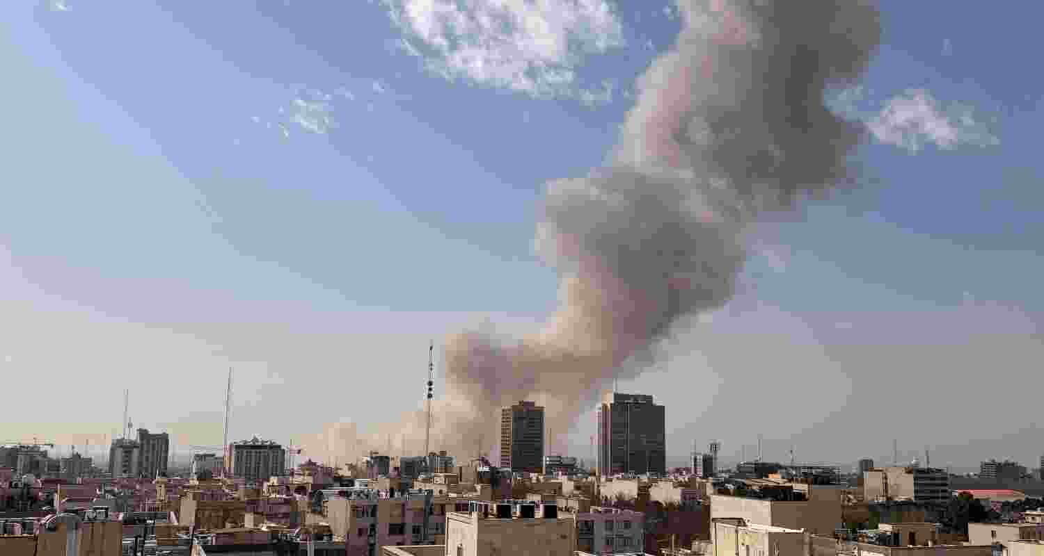 Smoke rises on the skyline after an explosion in Tehran, Iran. 