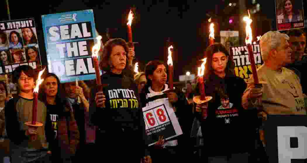 Family members and supporters of hostages taken during Hamas’s October 7, 2023, attack on Israel hold torchlights during a protest calling for a ceasefire, in Tel Aviv on January 16, 2025.