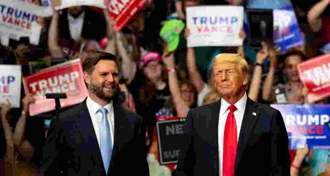 US Vice President JD Vance (L) alongside President Donald Trump at a MAGA event. 
