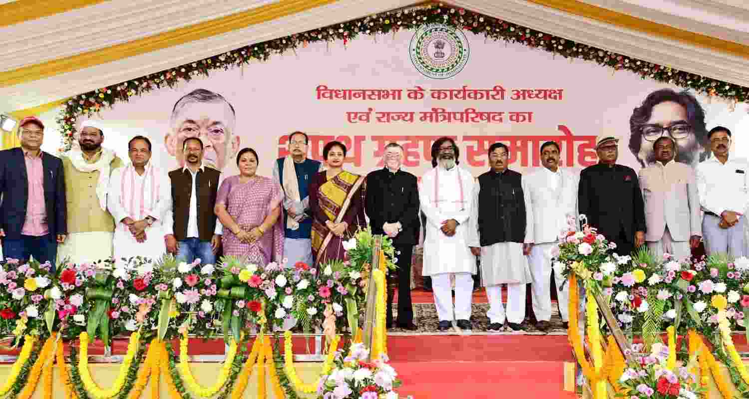 Jharkhand Governor Santosh Gangwar and CM Hemant Soren with JMM leader Kalpana Soren and newly sworn in state cabinet ministers pose for a group photograph during a ceremony at Raj Bhavan, in Ranchi, Thursday.