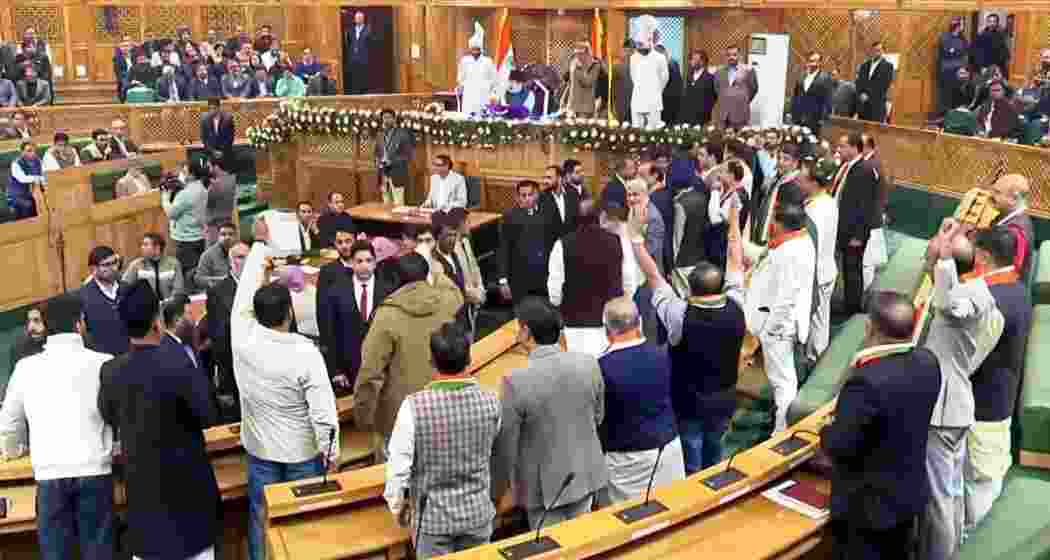 Ruckus in J&K Assembly as opposition MLAs raise slogans in protest over the special status resolution in Srinagar on Friday.