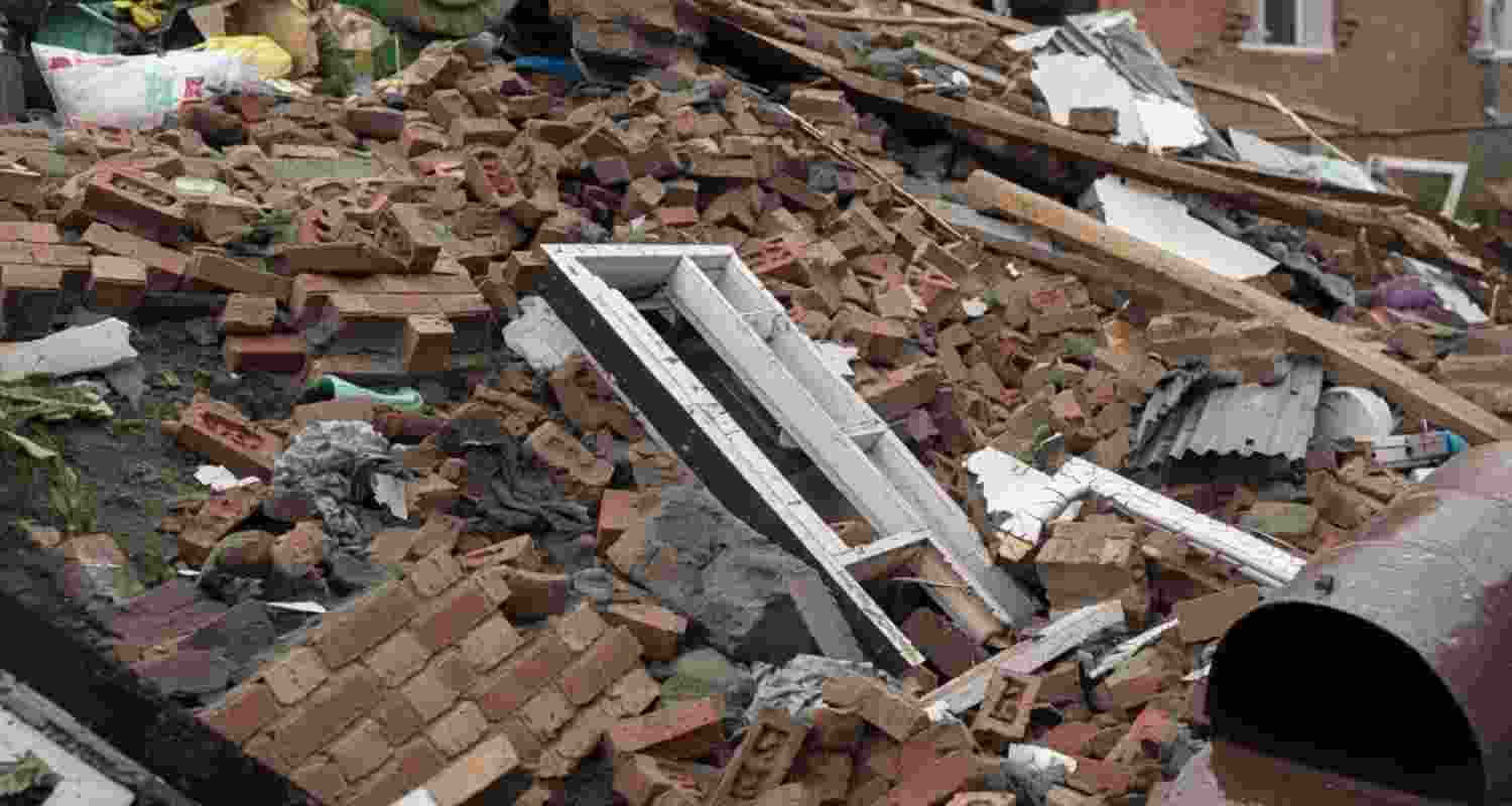 J&K authorities demolish houses of two Lashkar terrorists after a policeman was killed in Anantnag. One accused is on the MHA's most-wanted list.