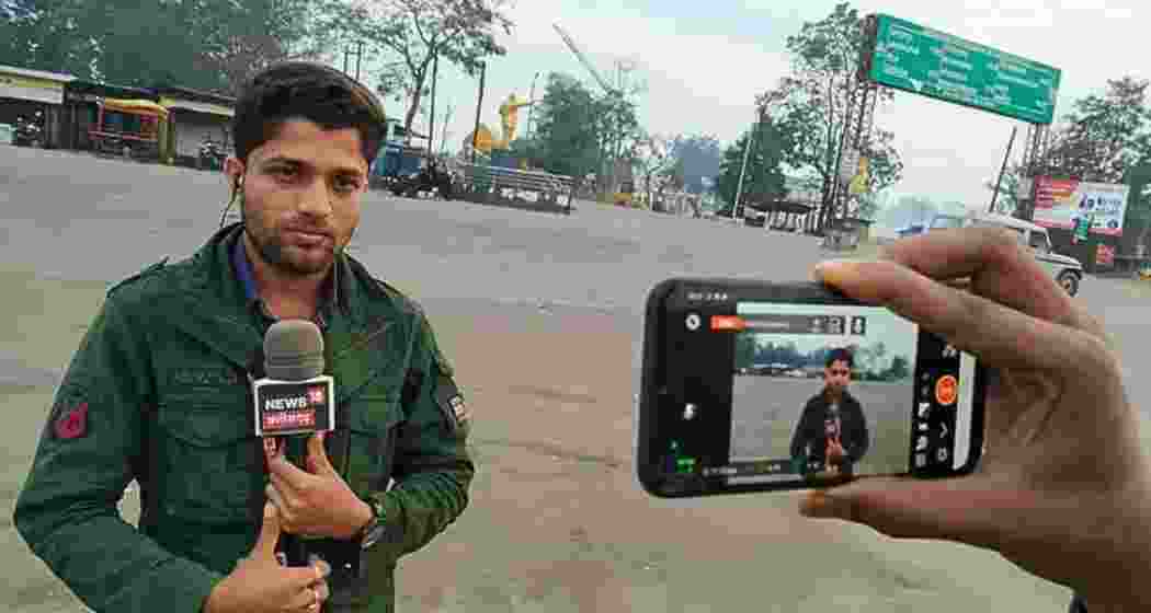 Investigative journalist Mukesh Chandrakar captured during field reporting, known for his fearless exposés of corruption, including the Rs 120-crore road project that led to his tragic murder.