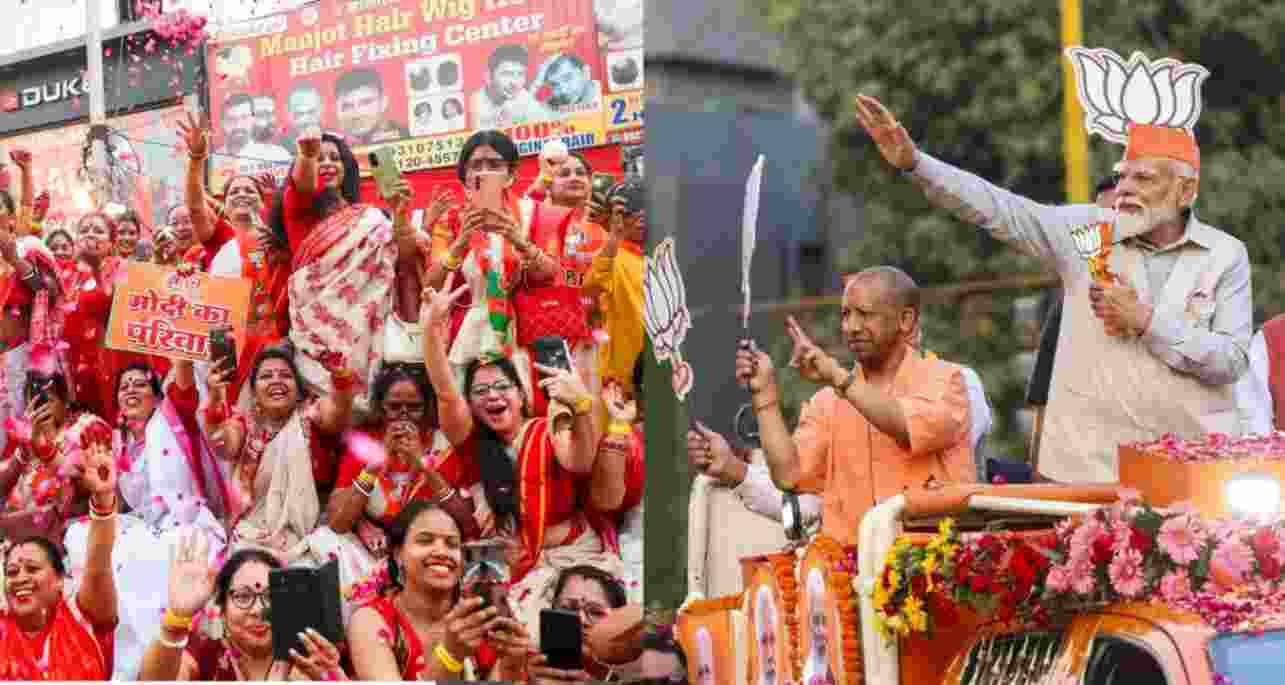 PM Modi during roadshow, while crowd cheers for him. 