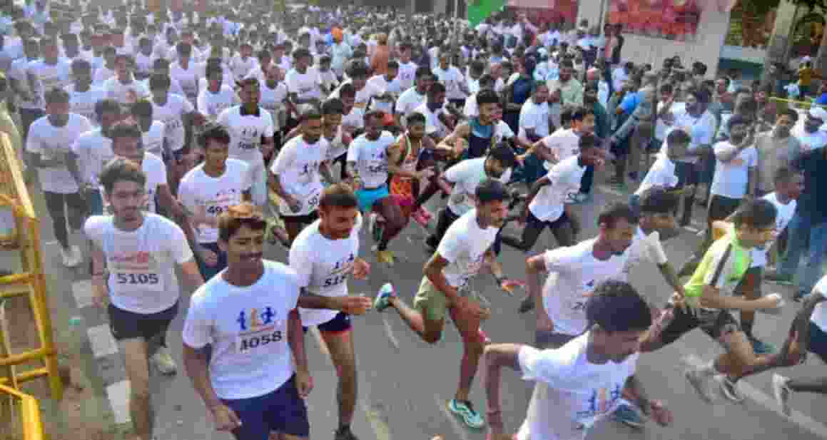People take part in the 'NaMo Yuva Run' on Sunday.