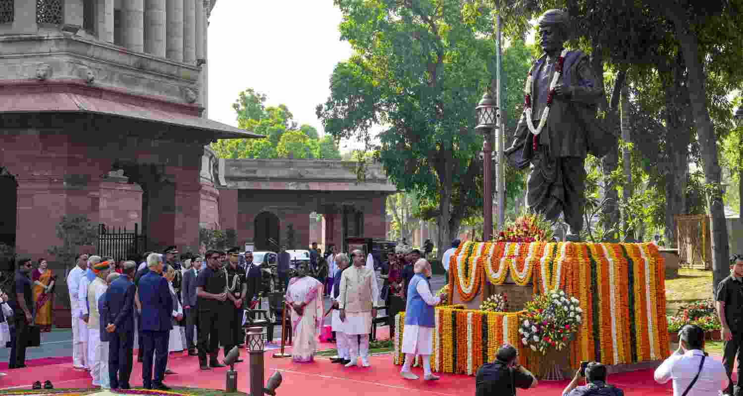 Prime Minister Narendra Modi pays tribute to the statue of Mahatma Jyotiba Phule during the latter's 200th birth anniversary celebration, at the Parliament premises, in New Delhi, Saturday, April 11, 2026. President Droupadi Murmu, Vice-President CP Radhakrishnan, Lok Sabha Speaker Om Birla, and others are also present. 