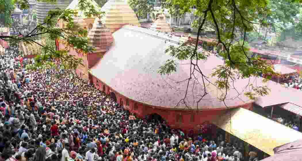 People throng the premises of Kamakhya Temple to offer prayers after the sacred doors of the temple re-opens, concluding the four-day annual Ambubachi Mela, in Guwahati, Assam, on Friday.