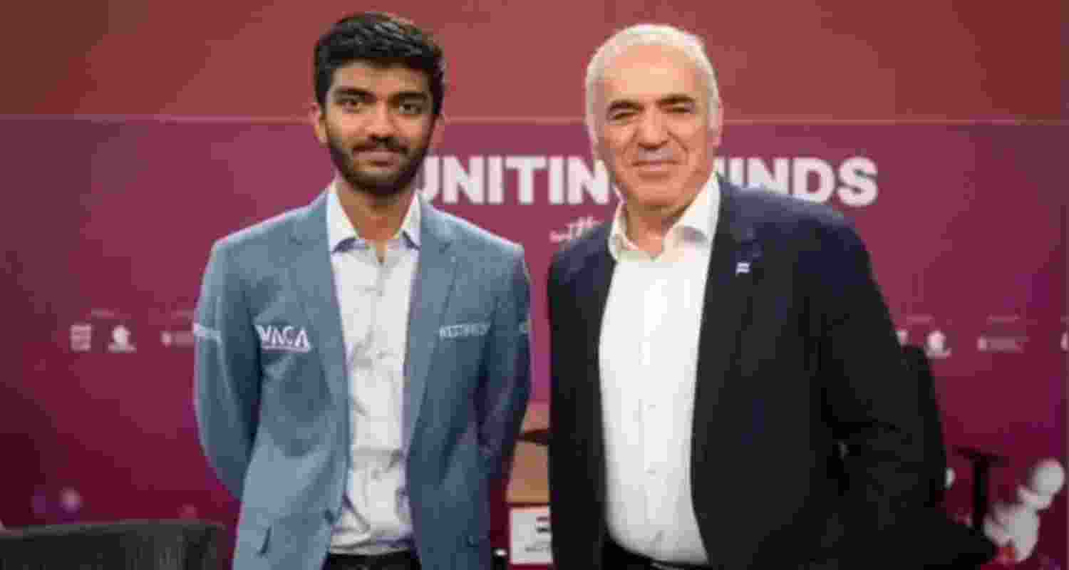 D Gukesh and Garry Kasparov pose for a picture. Via Garry Kasparov on Facebook.