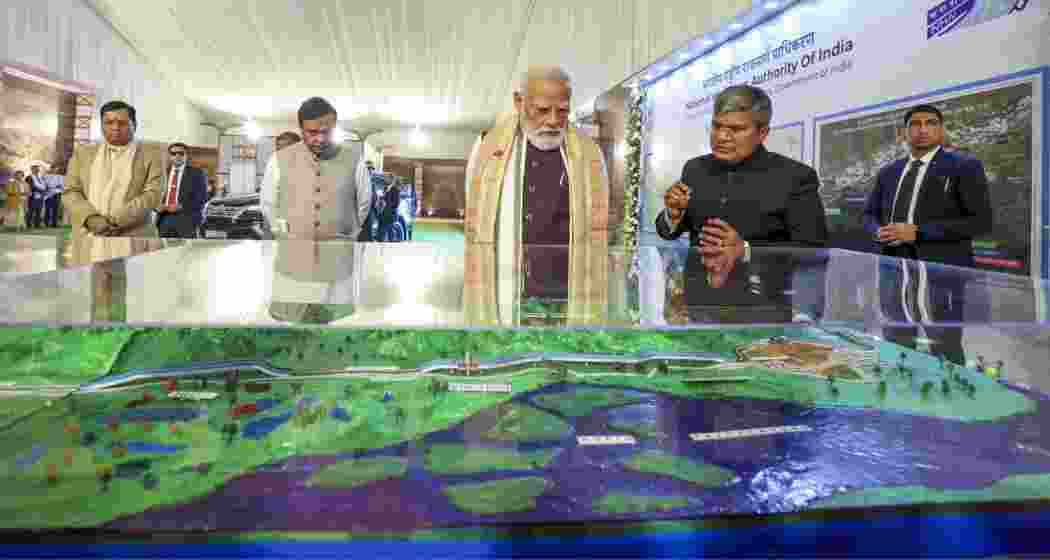 Prime Minister Narendra Modi looks at a model of Kaziranga Elevated Corridor during its foundation stone laying ceremony, in Nagaon district, Assam. Union Minister Sarbananda Sonowal and state Chief Minister Himanta Biswa Sarma also seen. 