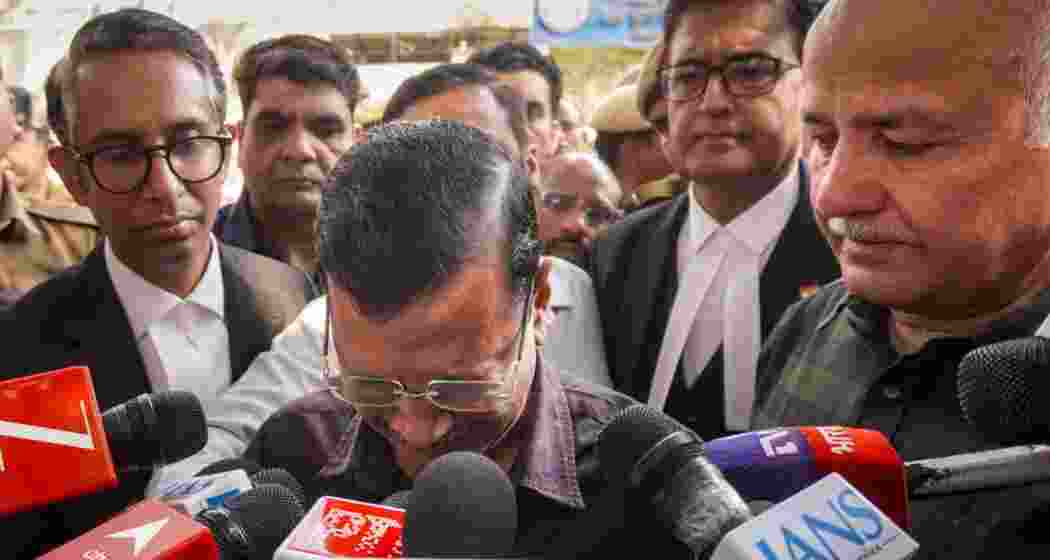 AAP national convener Arvind Kejriwal gets emotional as he and party leader Manish Sisodia address the media after a Delhi court discharged them in an excise policy-related corruption case, refusing to take cognisance of the CBI chargesheet, in New Delhi on Friday.