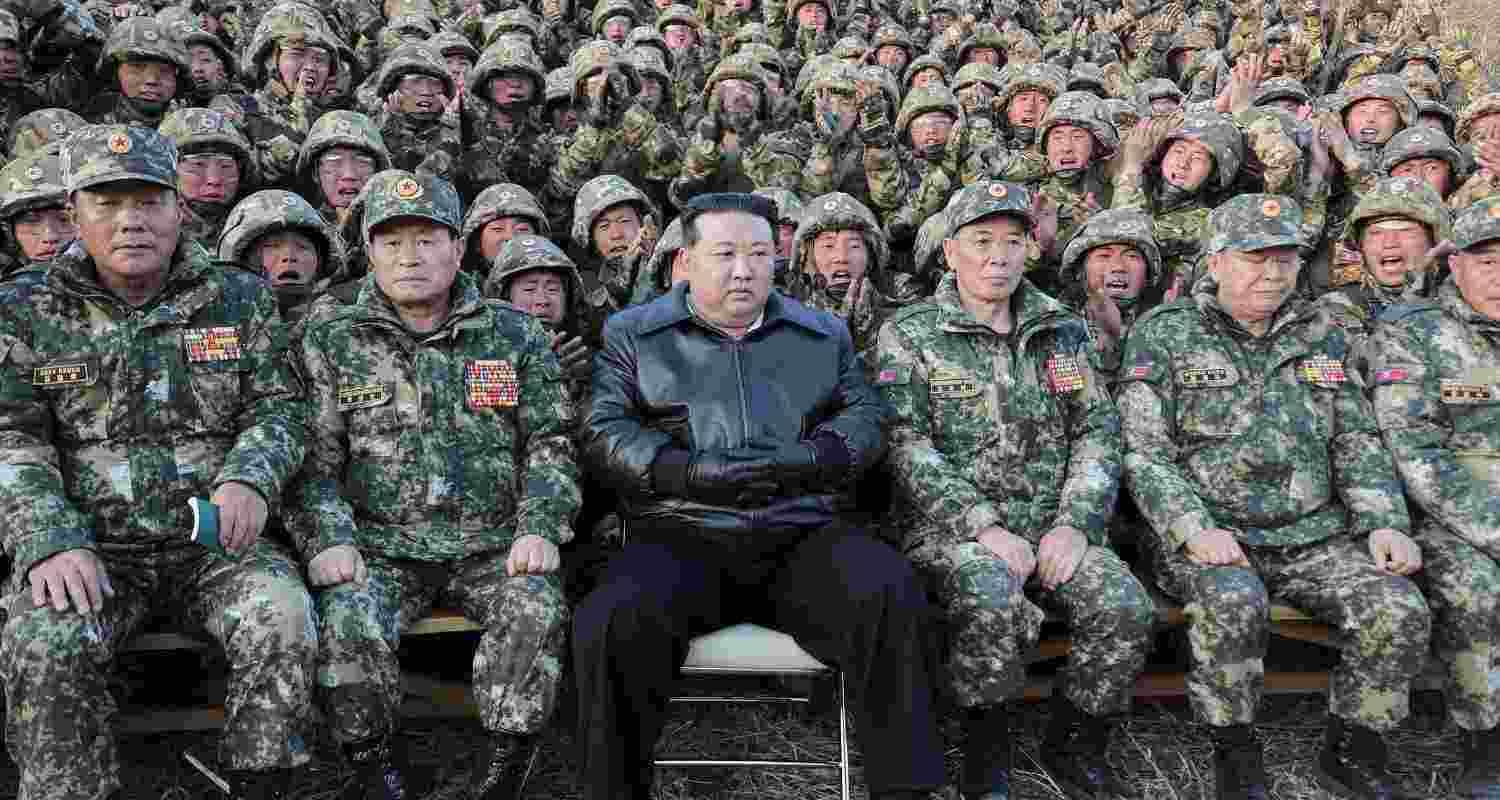 Dictator Kim Jong Un with members of the North Korean army, Pyongyang.