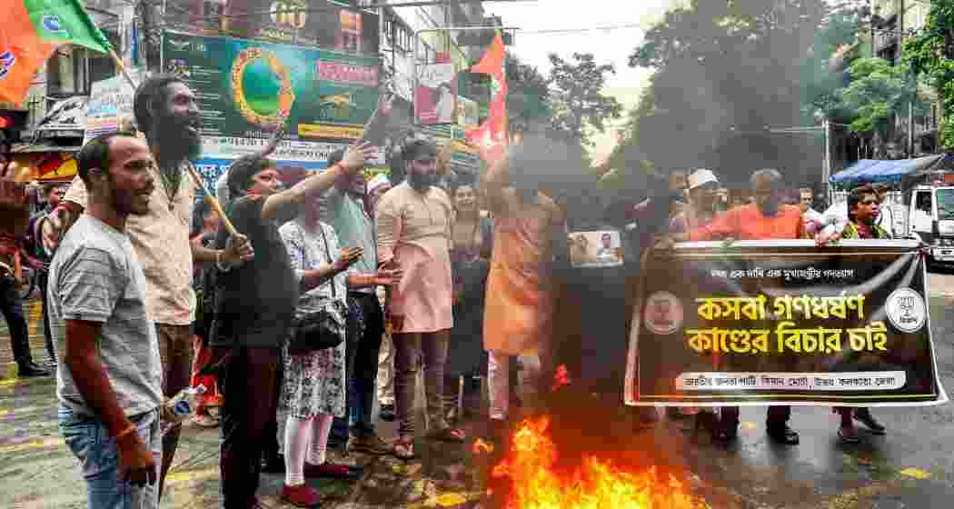 BJP members stage a demonstration against the alleged rape of a student at a law college, in Kolkata, Tuesday. BJP members stage a demonstration against the alleged rape of a student at a law college, in Kolkata, Tuesday.