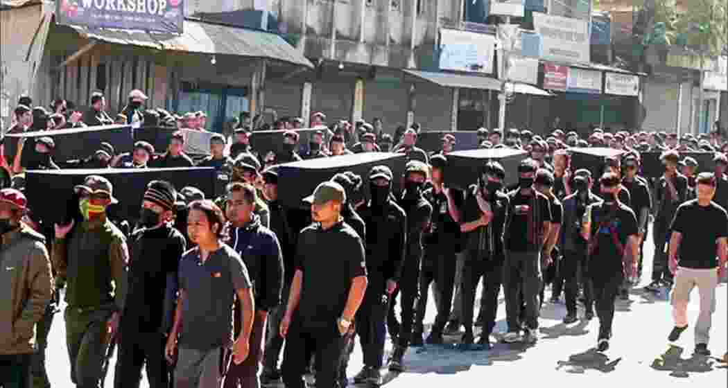 Kuki-Zo community members rally with the bodies of those they call martyrs.