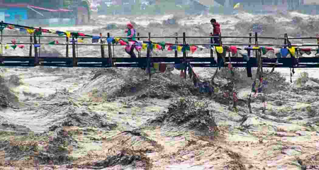 A swollen Beas River overflowing in Kullu.