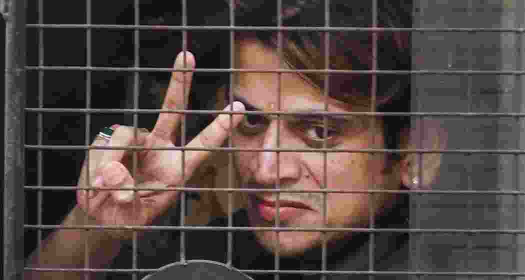 Shiv Sena (Shinde) worker Rahul Kanal being escorted after he was arrested for allegedly vandalising the Habitat Studio over stand-up comedian Kunal Kamra's alleged defamatory remarks against Maharashtra Deputy Chief Minister Eknath Shinde, in Mumbai, Monday, March 24, 2025.