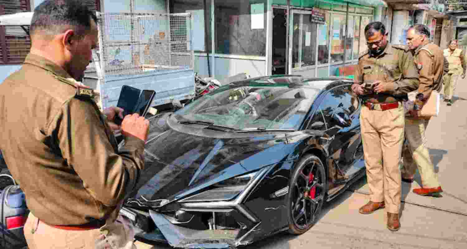 CCTV shows bouncers rescuing Lamborghini driver after crash