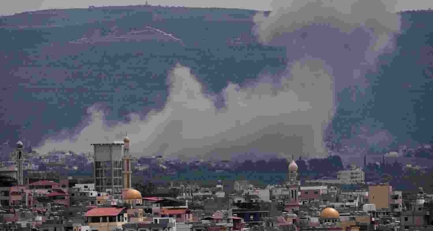Smoke rises following an Israeli airstrike on the village of Qlaileh, as seen from the southern port city of Tyre, Lebanon, Wednesday, April 15, 2026.