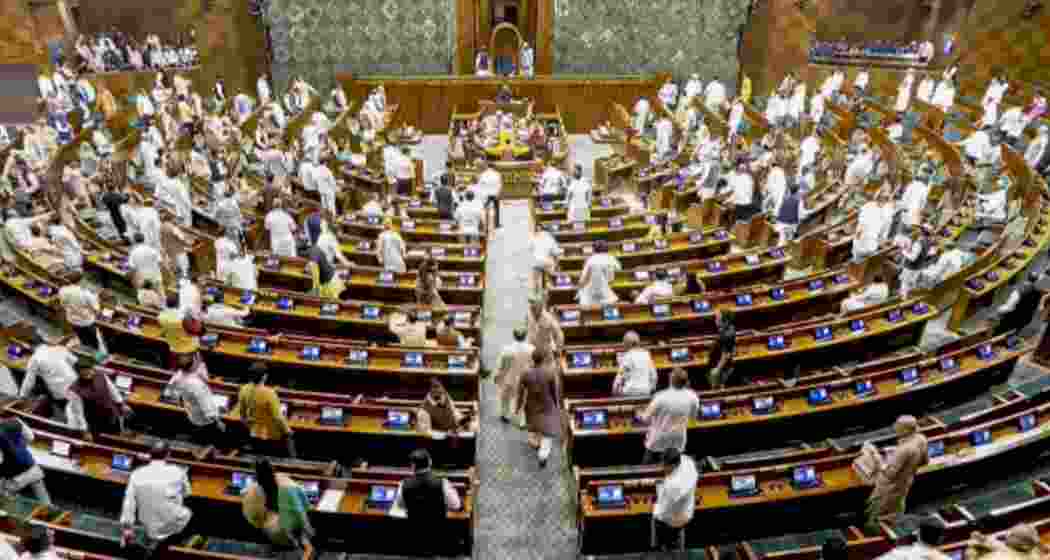 Members leave after the Lok Sabha was adjourned sine die, during the Special session of Parliament, in New Delhi, on Saturday.