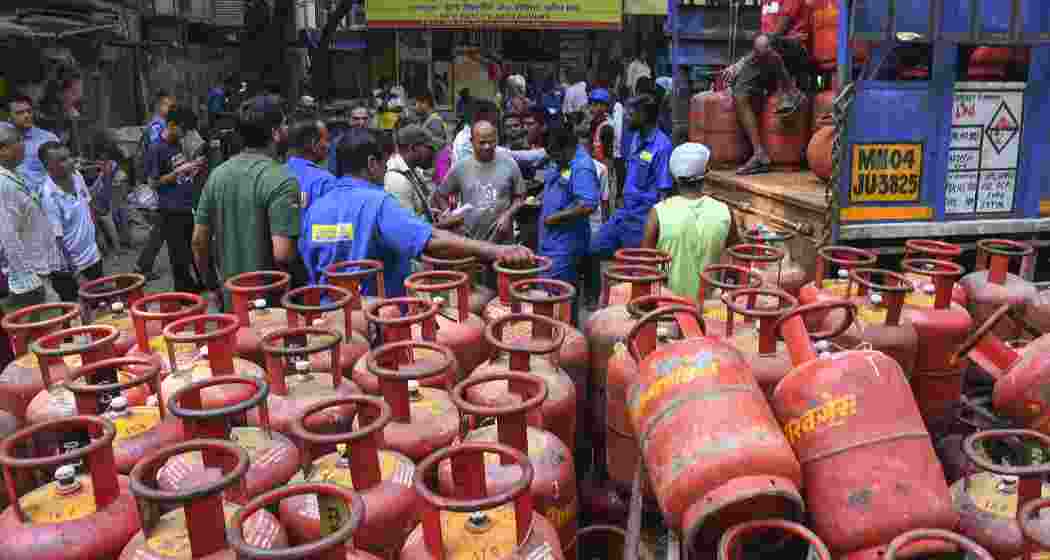 Consumers gather to avail LPG cylinders amid supply crisis in the country, in Mumbai, Maharashtra on Friday.