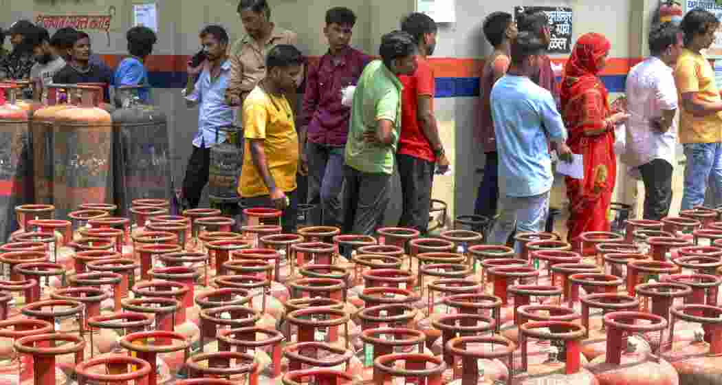  People gather at a gas agency to avail LPG cylinders, in Navi Mumbai, on Friday.