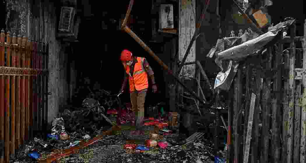 A rescue worker at the site of the fire incident in Lucknow.