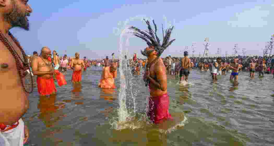 'Sadhus' and other devotees take a holy dip at the Sangam on the occasion of 'Mauni Amavasya', during the ongoing Maha Kumbh Mela, in Prayagraj on Wednesday, Jan. 29, 2025. File photo.