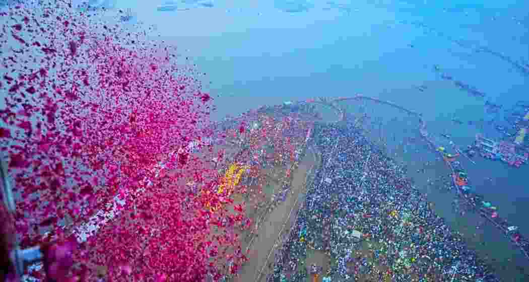 Flower petals being showered on saints and seers during the ‘Amrit Snan’ at Triveni Sangam on Basant Panchami in Prayagraj. Flower petals being showered on saints and seers during the ‘Amrit Snan’ at Triveni Sangam on Basant Panchami in Prayagraj.
