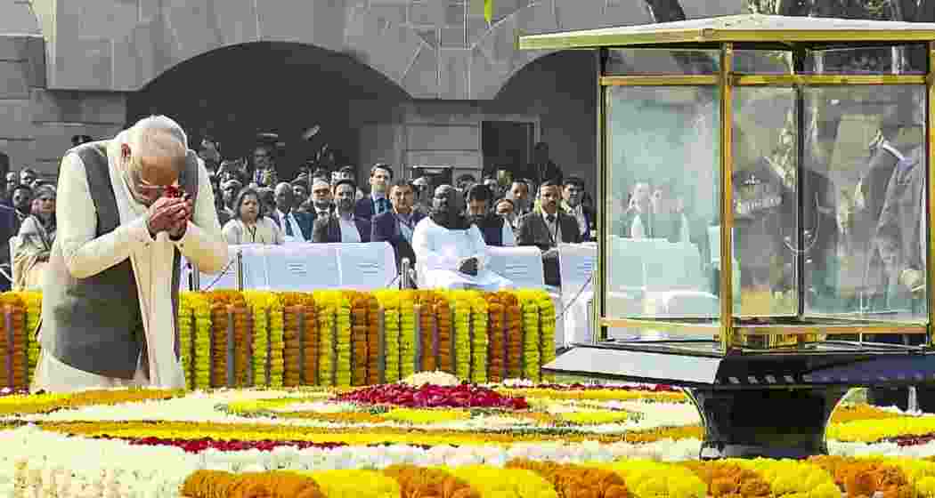 Prime Minister Narendra Modi pays homage to Mahatma Gandhi on his death anniversary at Rajghat, in New Delhi on Thursday.